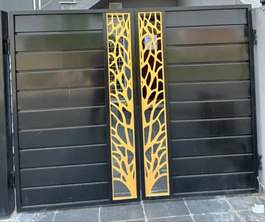 The entrance to Psyched on VIP Block, Pine Avenue — a black gate with gold tree panels