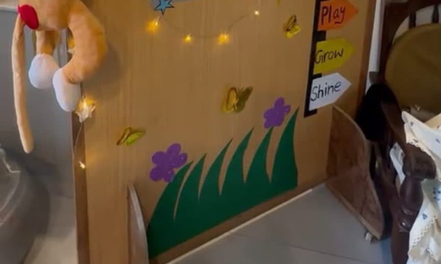 Inside Psyched: the children’s welcome board, with fairy lights, paper flowers and signposts reading “Play, Grow, Shine”